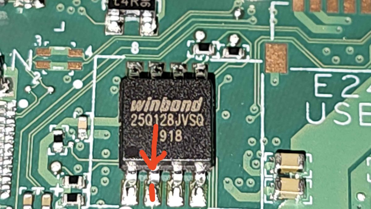 Close-up of the Winbond W25Q128JVSQ chip on the XU68 PRVROM pad